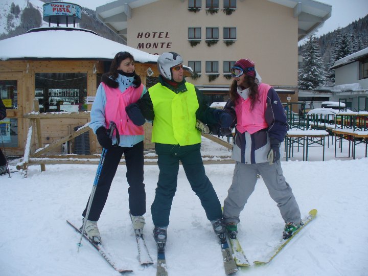 Guides and skier outside the hotel.