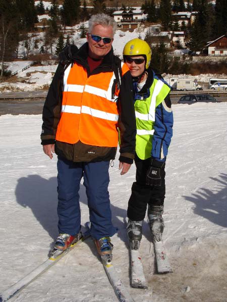 Guide and skier smiling.