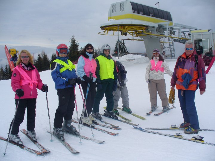 Group of skiers by a chair lift.